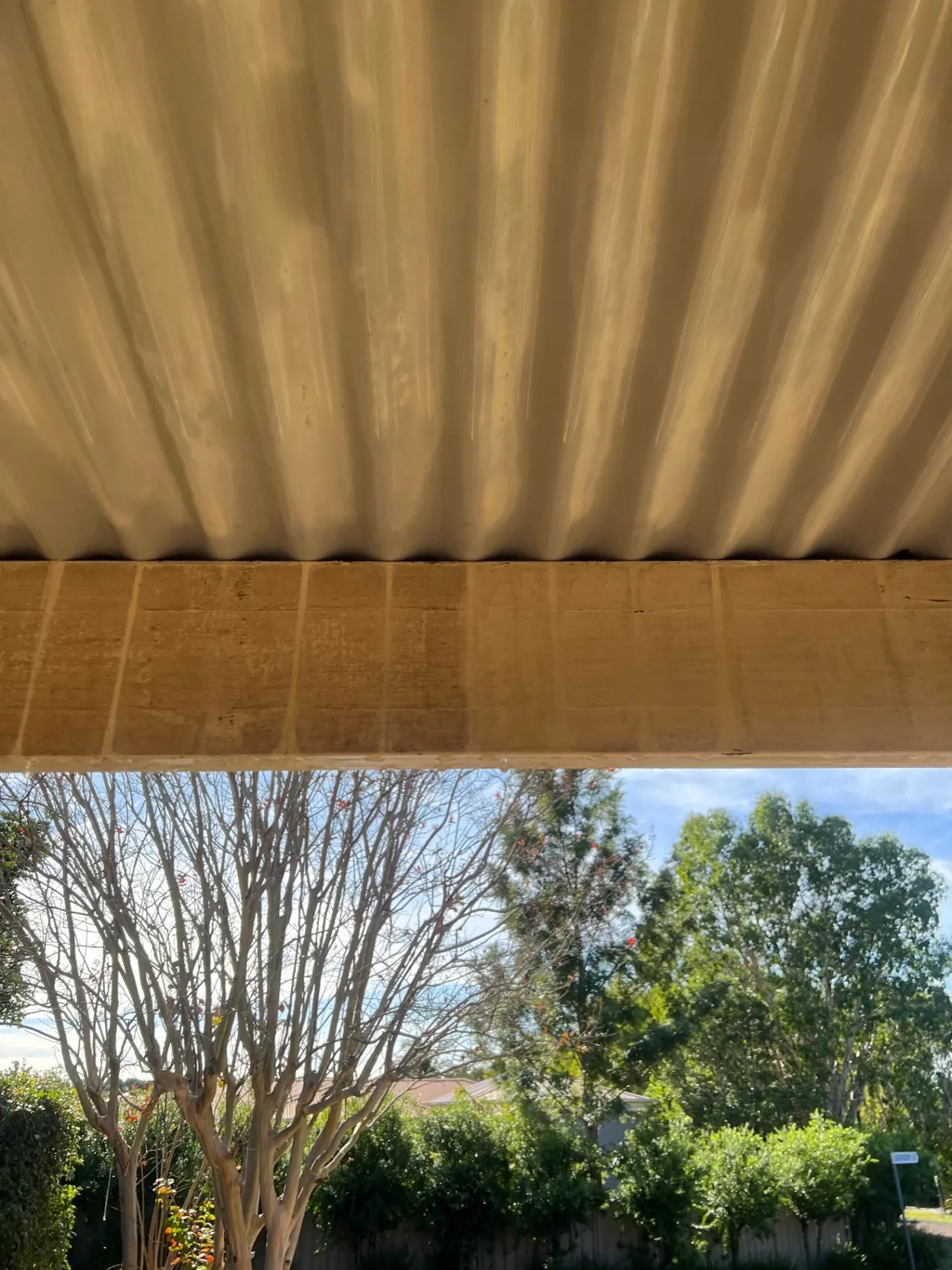 Dirty eave and gutter line showing build-up from a gutter cleaning job